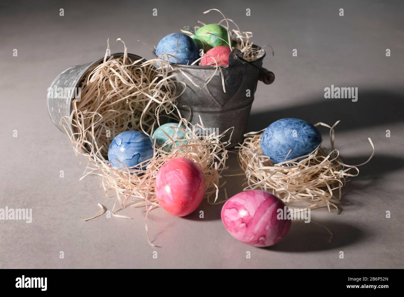 Various painted easter eggs with metal buckets Stock Photo