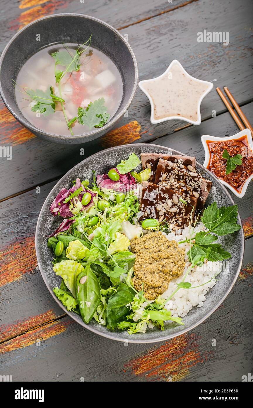 Organic asian healthy food. Buddha bowl with salmon fish soup, salad