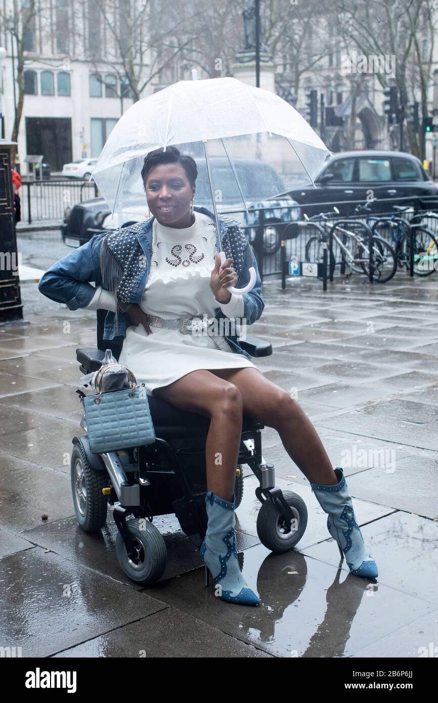 Girl in wheelchair in rain hires stock photography and images Alamy