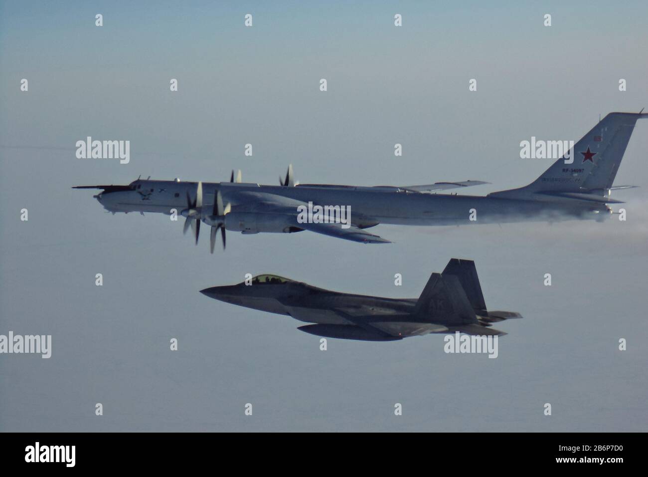Washington DC, USA. 11th Mar, 2020. North American Aerospace Defense Command F-22s, CF-18s, supported by KC-135 Stratotanker and E-3 Sentry AWACS aircraft, intercepted two Russian Tu-142 maritime reconnaissance aircraft entering the Alaskan Air Defense Identification Zone on March 9, 2020. The Russian aircraft were loitering about 2,500 feet above a camp that was built for the U.S. submarine exercise known as ICEX. Photo by NORAD/UPI Credit: UPI/Alamy Live News Stock Photo
