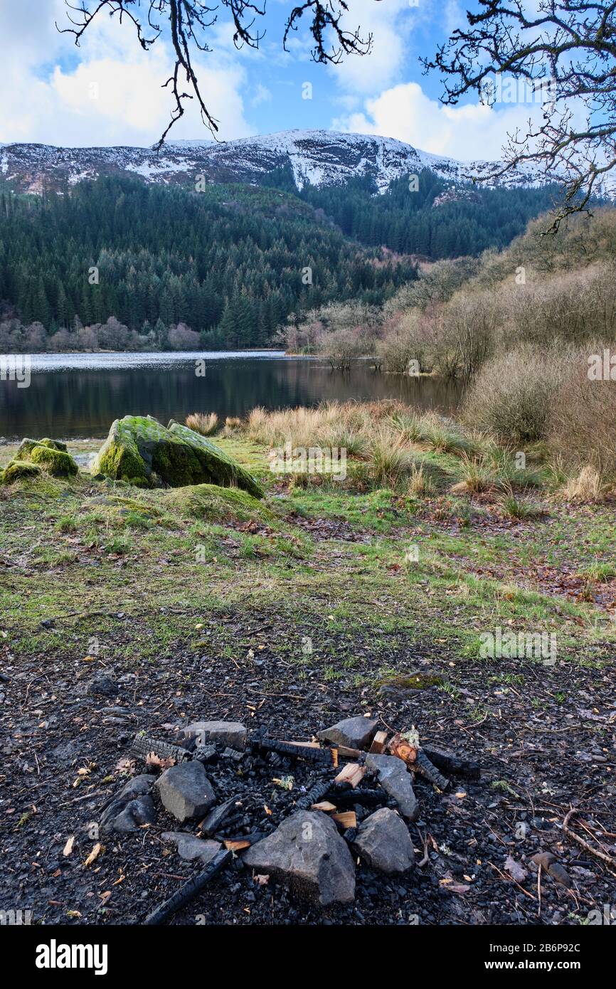 A campfire beside Loch Chon near Aberfoyle, Stirling, Scotland Stock Photo