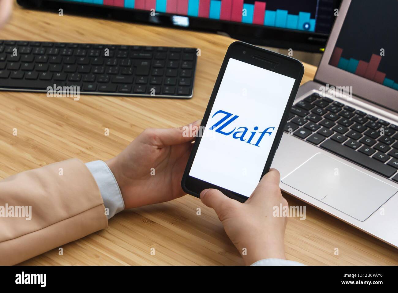 Zaif Cryptocurrency Exchange Market. Female Trader Hands Holding the Smartphone Using Application. Crypto Background Concept, San Francisco Stock Photo