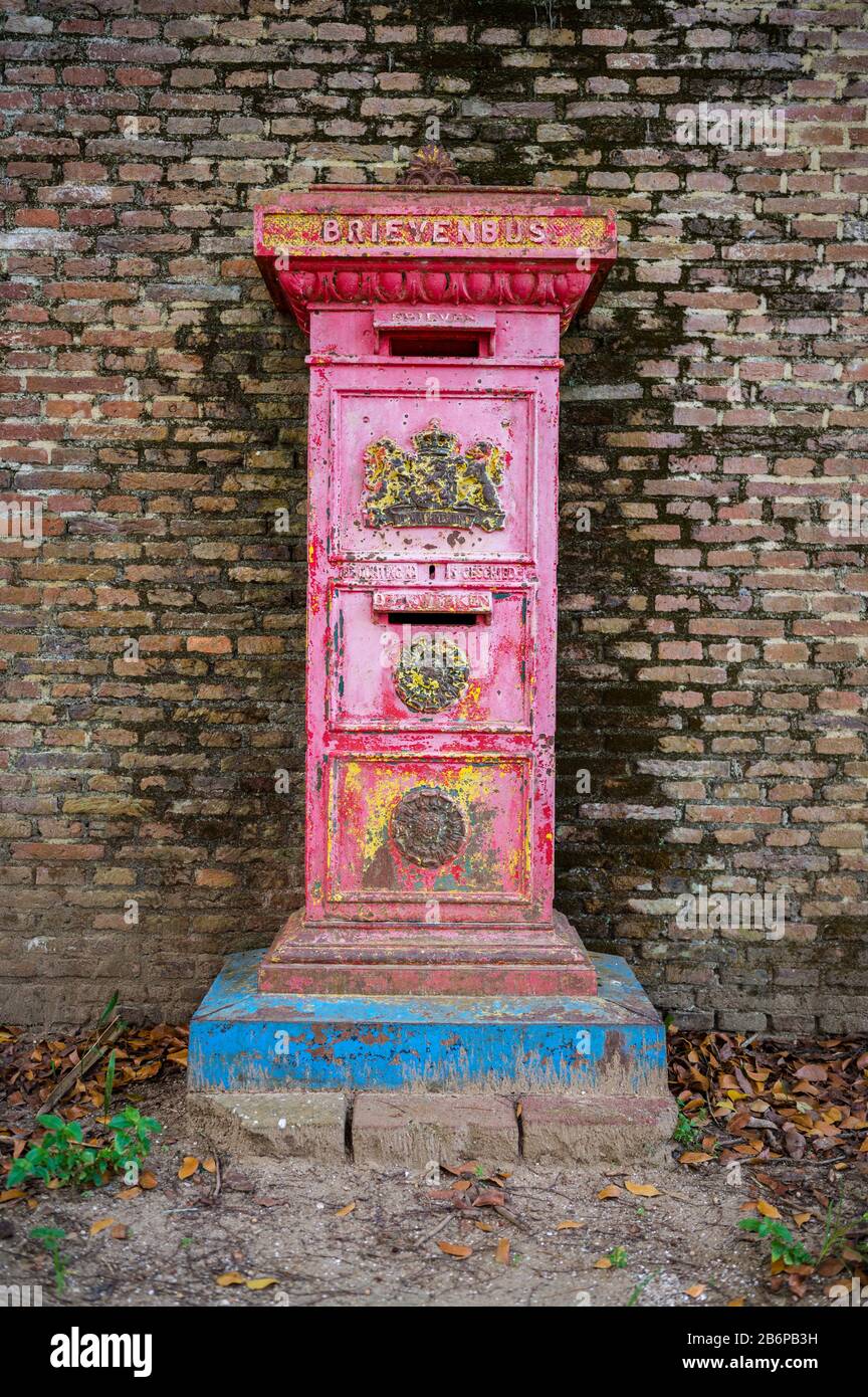 Old red dutch post box at Fort Zeelandia, Paramaribo, Suriname Stock Photo