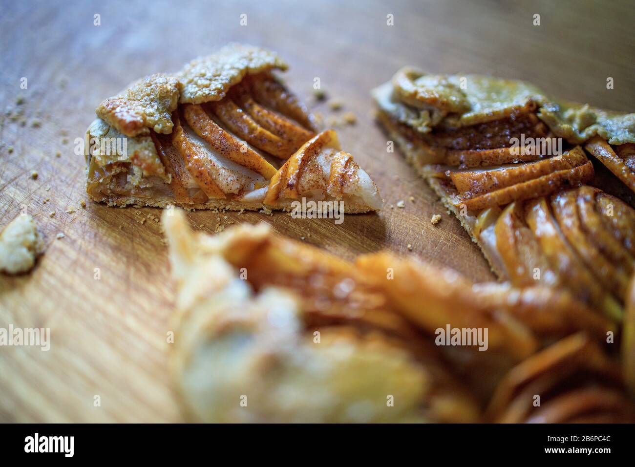 apple galette - pie on white baking parchment. Copy space, flat lay Stock Photo