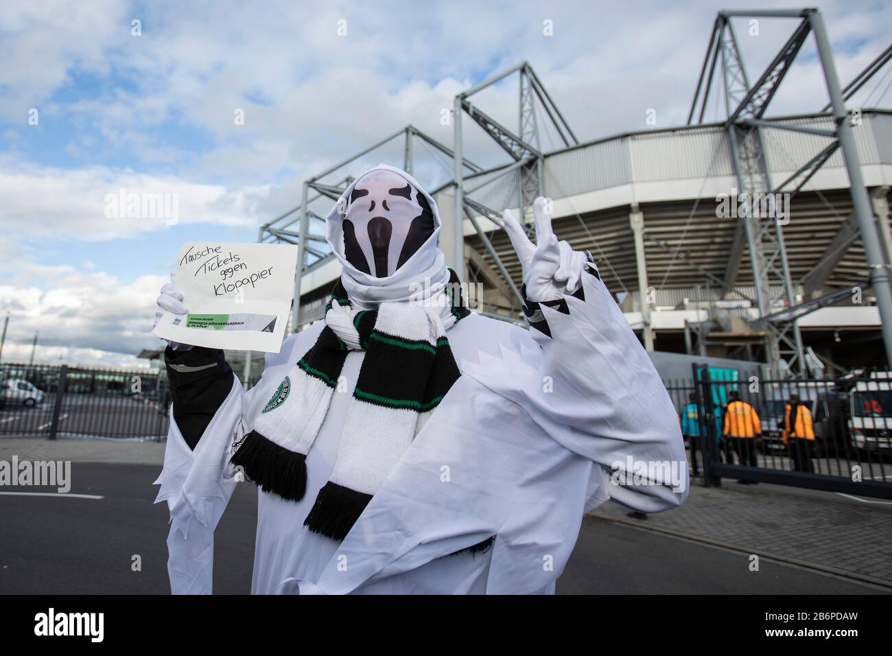 Monchengladach, Germany. 11th Mar, 2020. Fans with ghost costume „Tausche Tickets gegen Klopapier“ prior the Bundesliga match Borussia Mönchengladbach vs. 1.FC Köln in the season 2019/2020 (Geisterspiel, ghost game, coronavirus) DFL regulations prohibit any use of photographs as image sequences and/or quasi-video. Credit: Mika Volkmann/Alamy Live News Stock Photo
