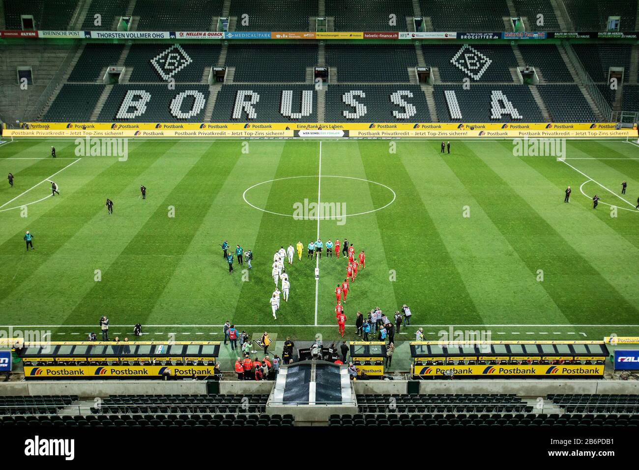Monchengladach, Germany. 11th Mar, 2020. Empty stadium with empty places, players come into the stadium during the Bundesliga match Borussia Mönchengladbach vs. 1.FC Köln in the season 2019/2020 (Geisterspiel, ghost game, coronavirus) DFL regulations prohibit any use of photographs as image sequences and/or quasi-video. Credit: Mika Volkmann/Alamy Live News Stock Photo