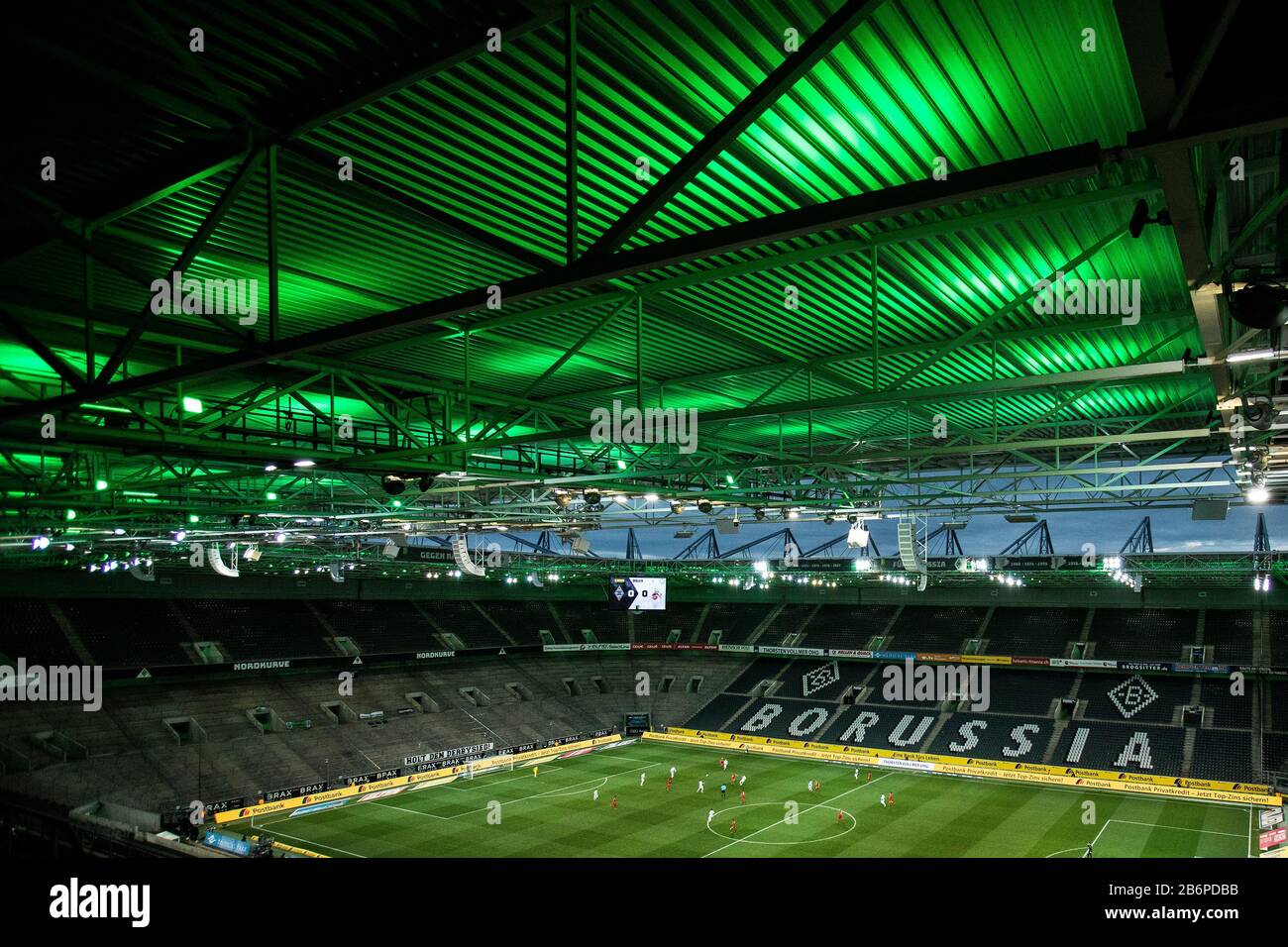 Monchengladach, Germany. 11th Mar, 2020. Empty stadium with empty places, players come into the stadium during the Bundesliga match Borussia Mönchengladbach vs. 1.FC Köln in the season 2019/2020 (Geisterspiel, ghost game, coronavirus) DFL regulations prohibit any use of photographs as image sequences and/or quasi-video. Credit: Mika Volkmann/Alamy Live News Stock Photo