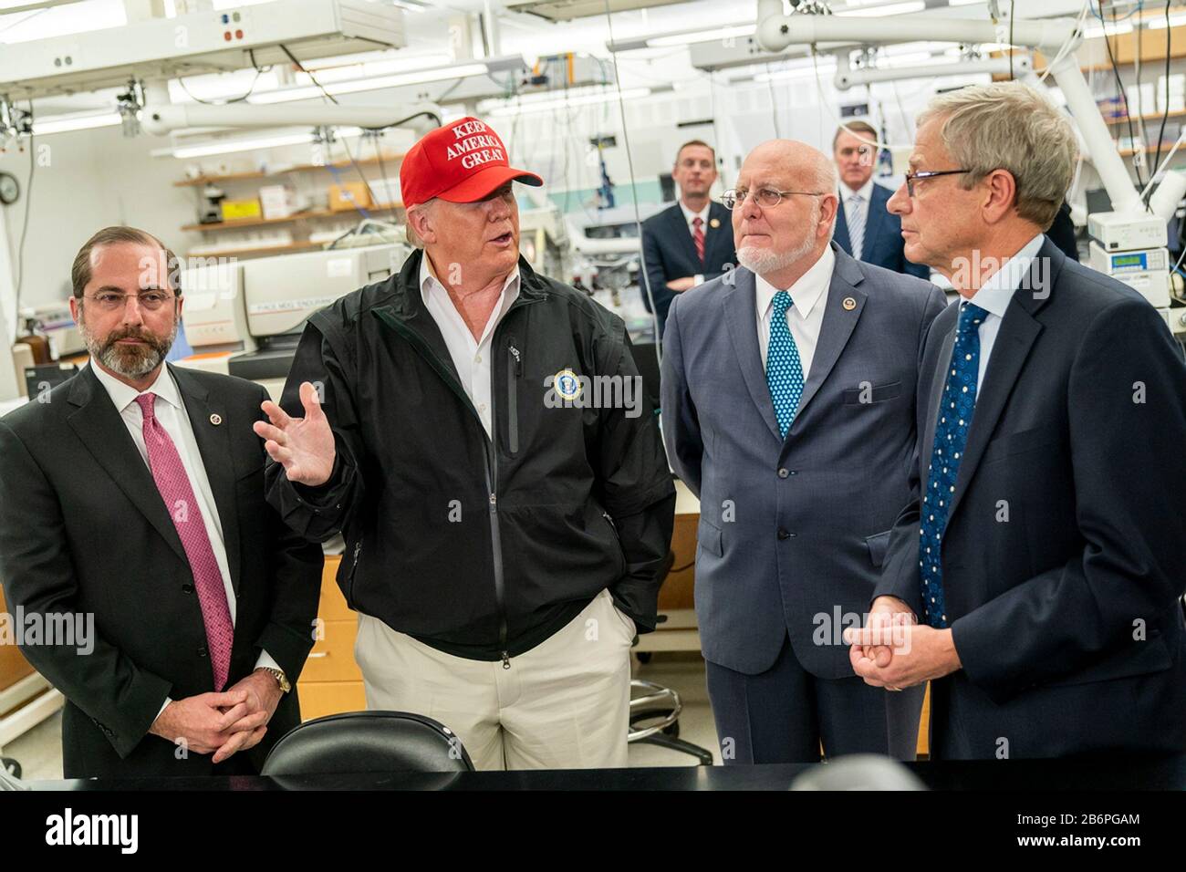 U.S President Donald Trump joined by the Secretary of Health and Human Services Alex Azar, left, Director of Centers for Disease Control and Prevention Dr. Robert Redfield, and Dr. Stephan Monroe, associate director of the CDC, right, speaks with reporters during a visit to the Centers for Disease Control and Prevention March 6, 2020 in Atlanta, Georgia. Stock Photo