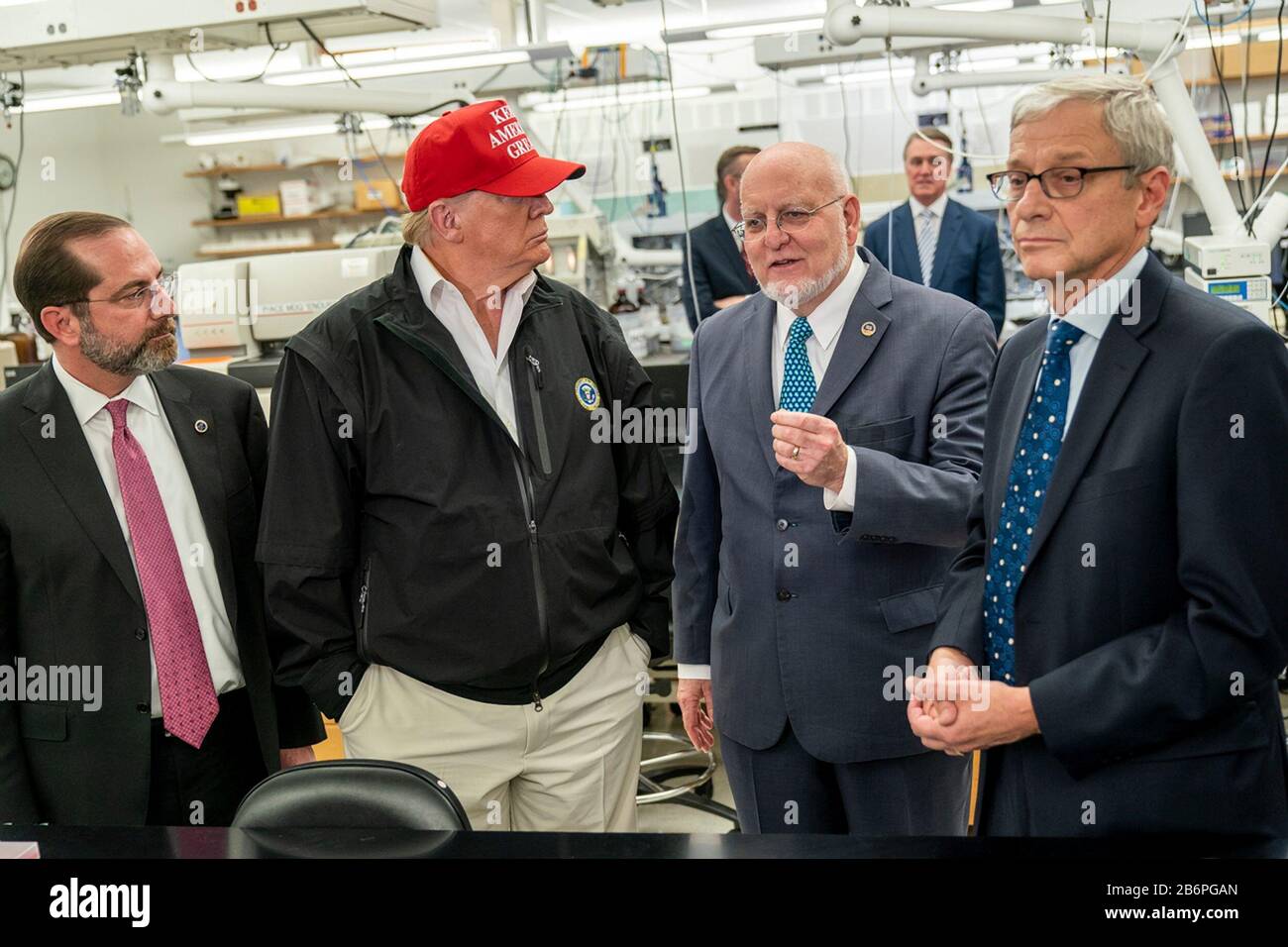 U.S President Donald Trump joined by the Secretary of Health and Human Services Alex Azar, left, Director of Centers for Disease Control and Prevention Dr. Robert Redfield, and Dr. Stephan Monroe, associate director of the CDC, right, speaks with reporters during a visit to the Centers for Disease Control and Prevention March 6, 2020 in Atlanta, Georgia. Stock Photo