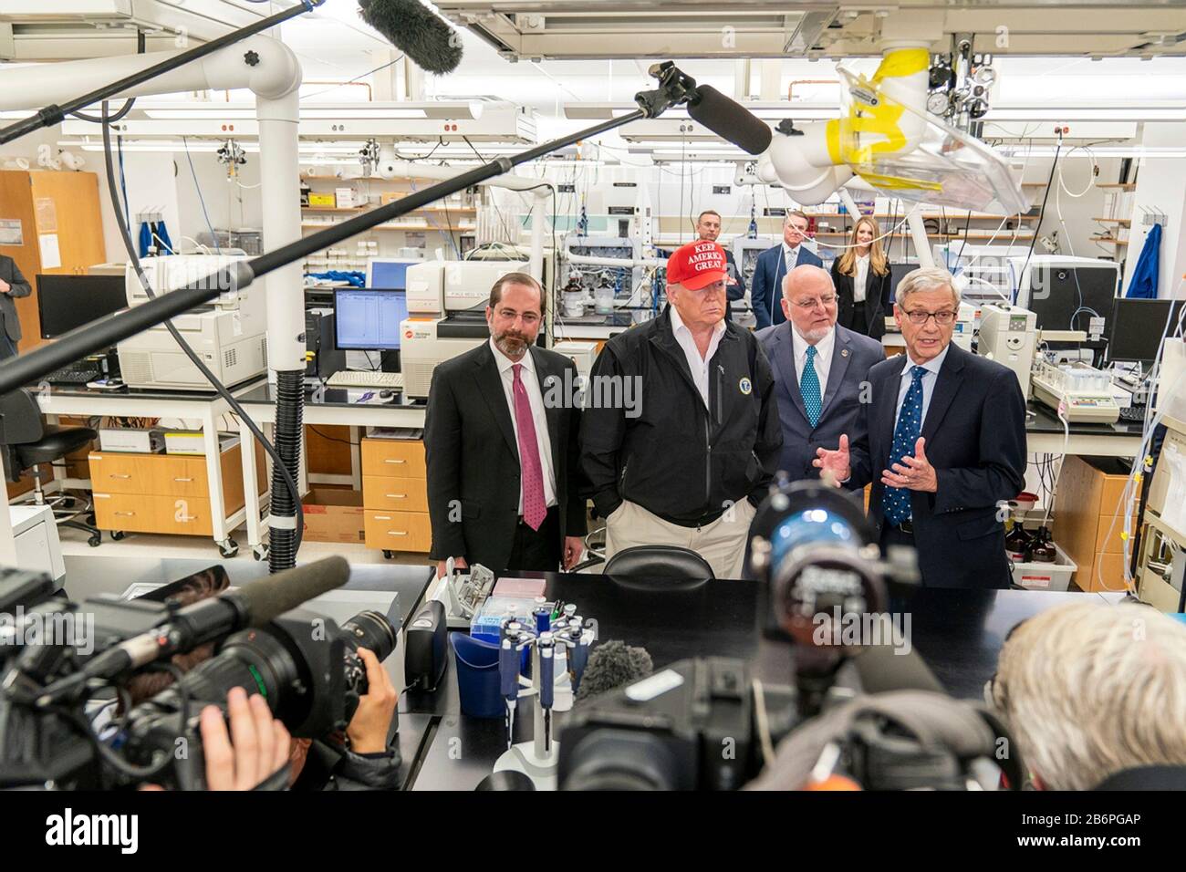 U.S President Donald Trump joined by the Secretary of Health and Human Services Alex Azar, left, Director of Centers for Disease Control and Prevention Dr. Robert Redfield, and Dr. Stephan Monroe, associate director of the CDC, right, speaks with reporters during a visit to the Centers for Disease Control and Prevention March 6, 2020 in Atlanta, Georgia. Stock Photo