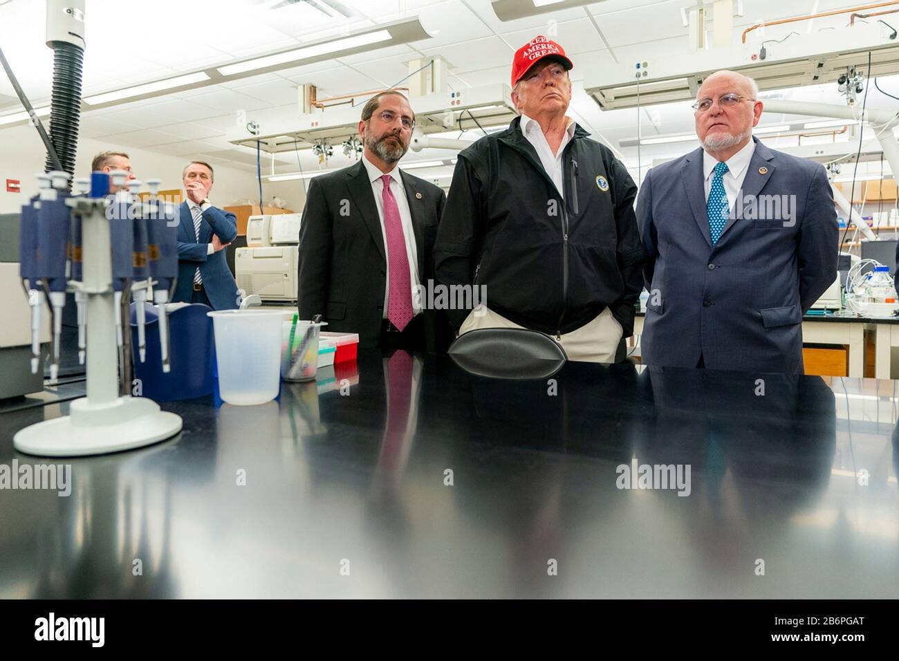 U.S President Donald Trump joined by the Secretary of Health and Human Services Alex Azar, left, Director of Centers for Disease Control and Prevention Dr. Robert Redfield, right, speaks with reporters during a visit to the Centers for Disease Control and Prevention March 6, 2020 in Atlanta, Georgia. Stock Photo