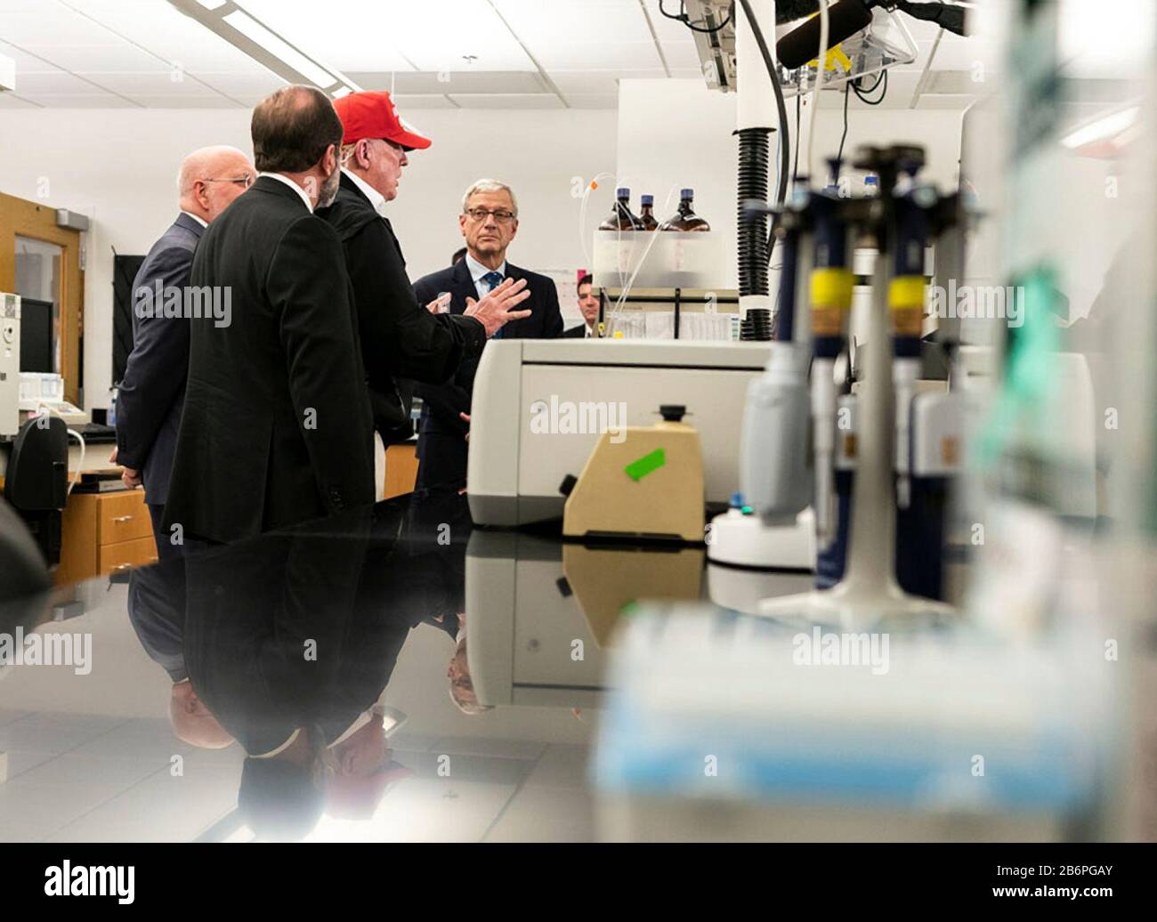 U.S President Donald Trump joined by the Secretary of Health and Human Services Alex Azar, left, and Director of Centers for Disease Control and Prevention Dr. Robert Redfield, right, speaks with reporters during a visit to the Centers for Disease Control and Prevention March 6, 2020 in Atlanta, Georgia. Stock Photo