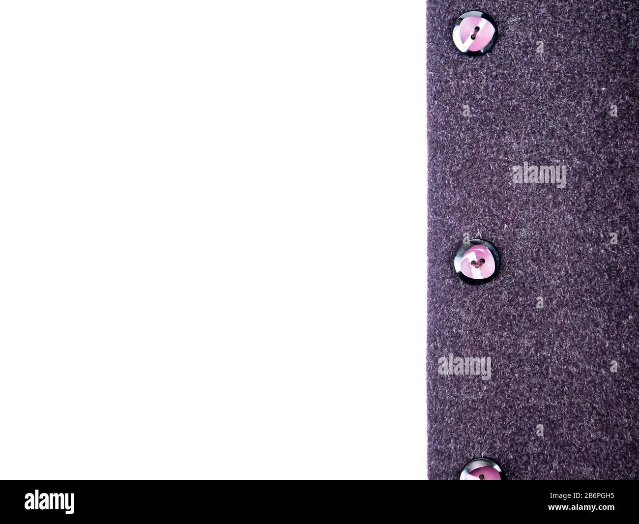 Colored button on a woolen cloth coat. Stock Photo