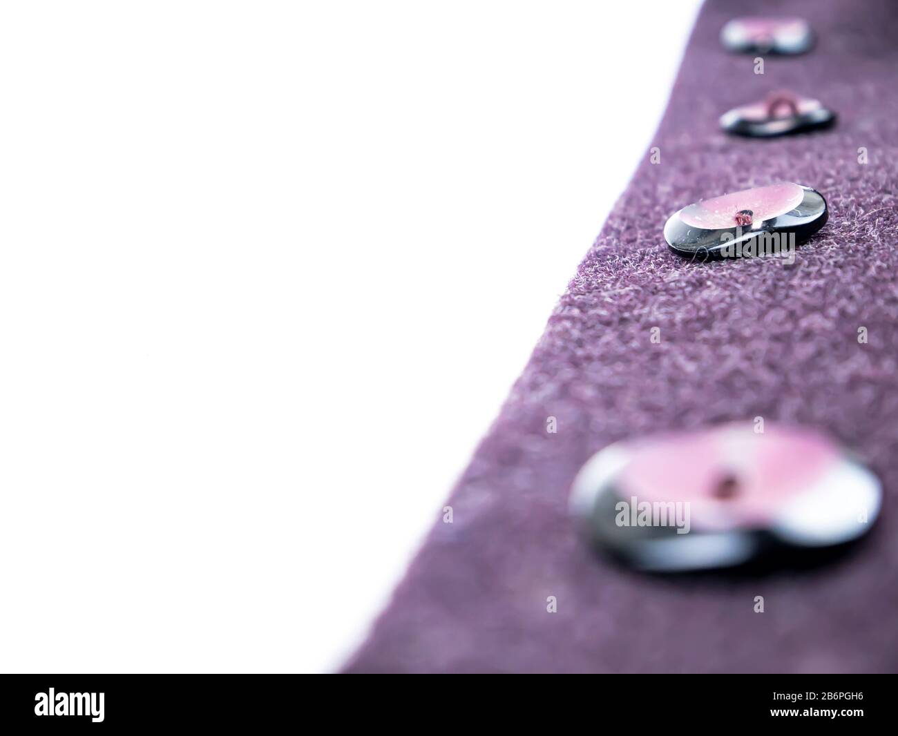 Colored button on a woolen cloth coat. Stock Photo