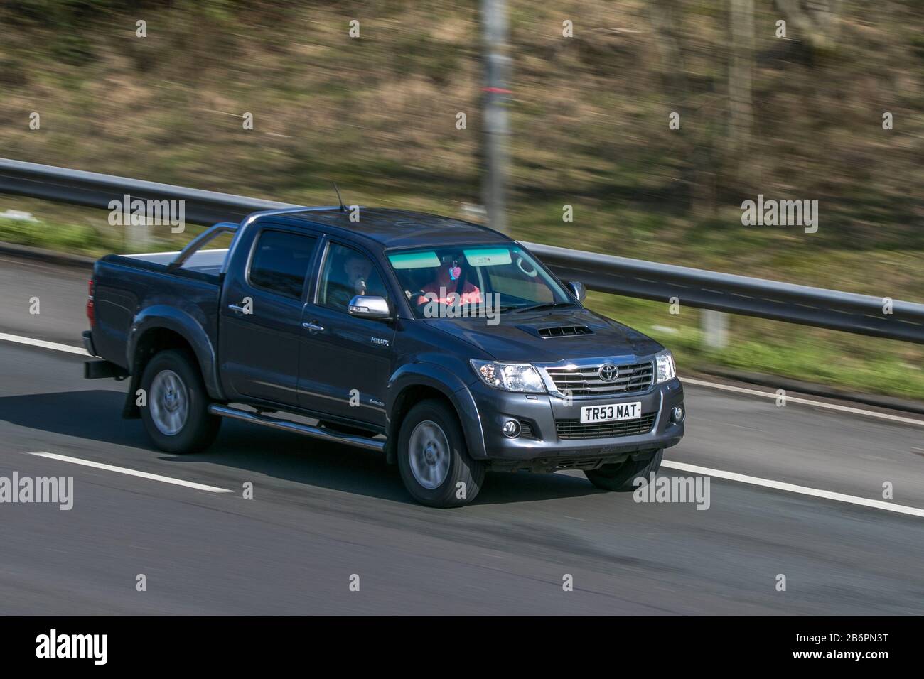2014 Toyota Hilux Invincible D-4D 4X4 dcb A Grey LCV Diesel driving on the M6 motorway near Preston in Lancashire, UK Stock Photo