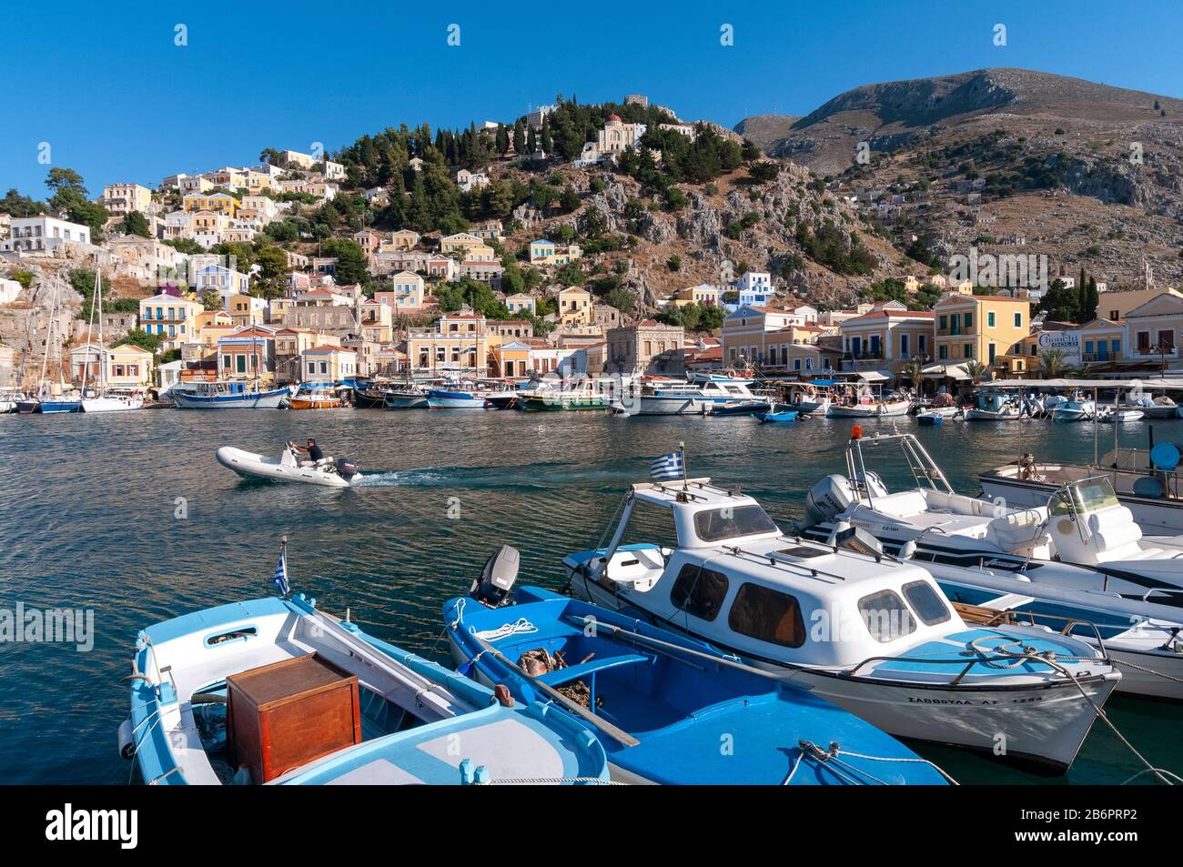 Fishing boats in harbour Symi Town Symi Greek Islands Greece Stock Photo Alamy