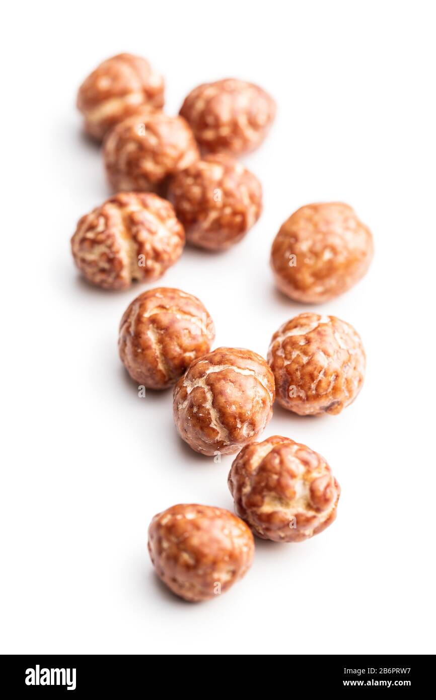 Hazelnuts with sugar icing isolated on white background. Stock Photo