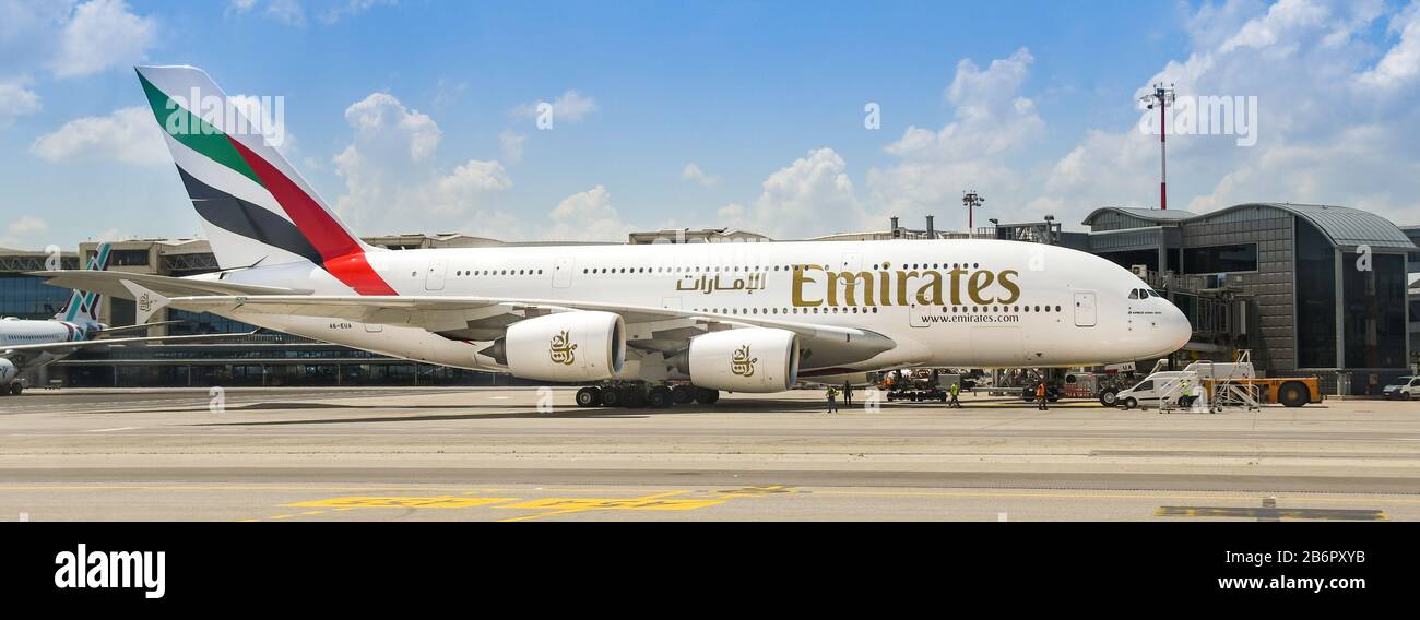MILAN, ITALY - JUNE 2019: Panoramic view of an Airbus A380 'Super jumbo' jet operated by Emirates on stand at Milan Malpensa airport. Stock Photo
