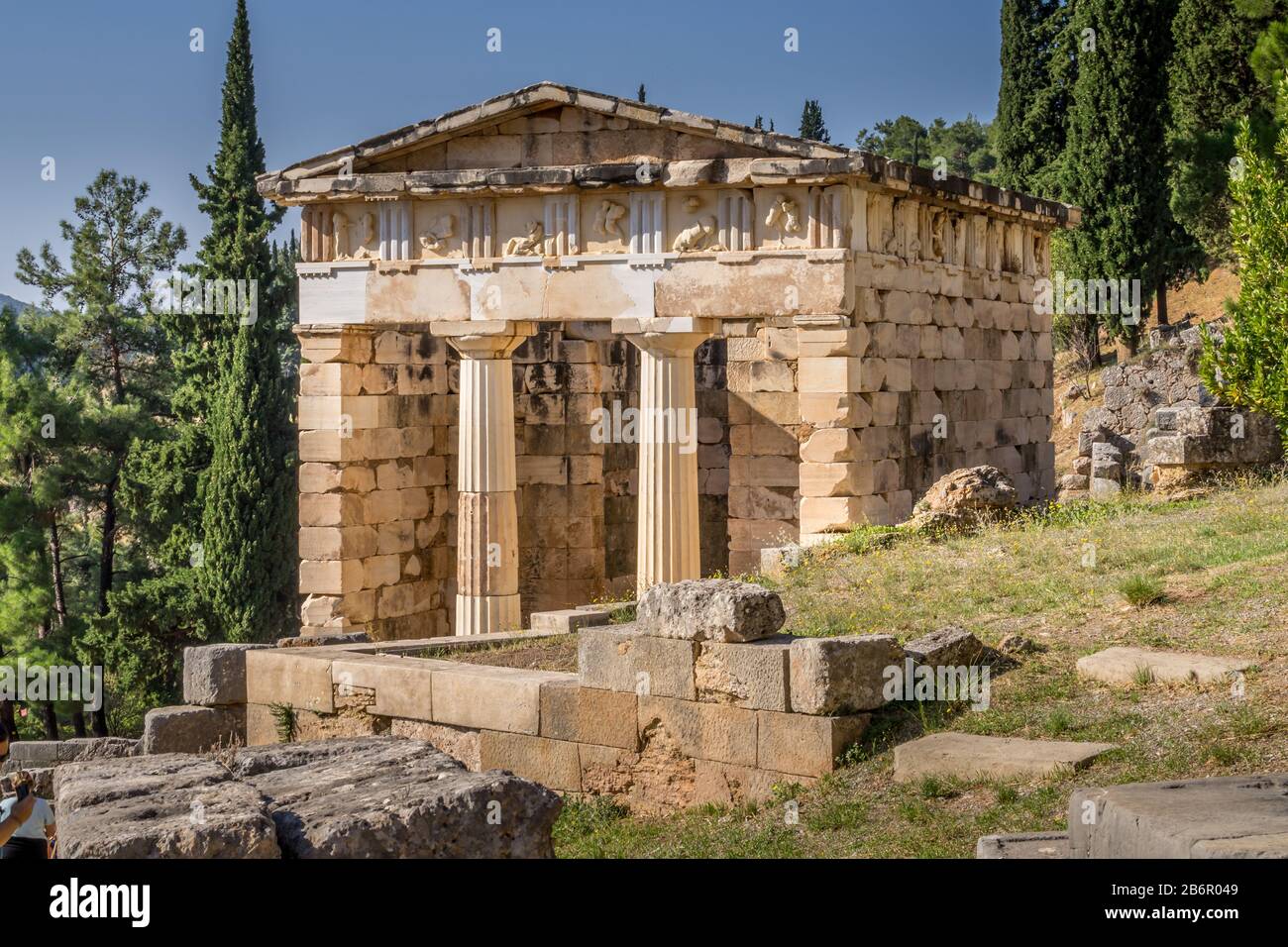 Reconstructed Athenian Treasury with doric columns and stone block construction at Delphi in Greece. Stock Photo