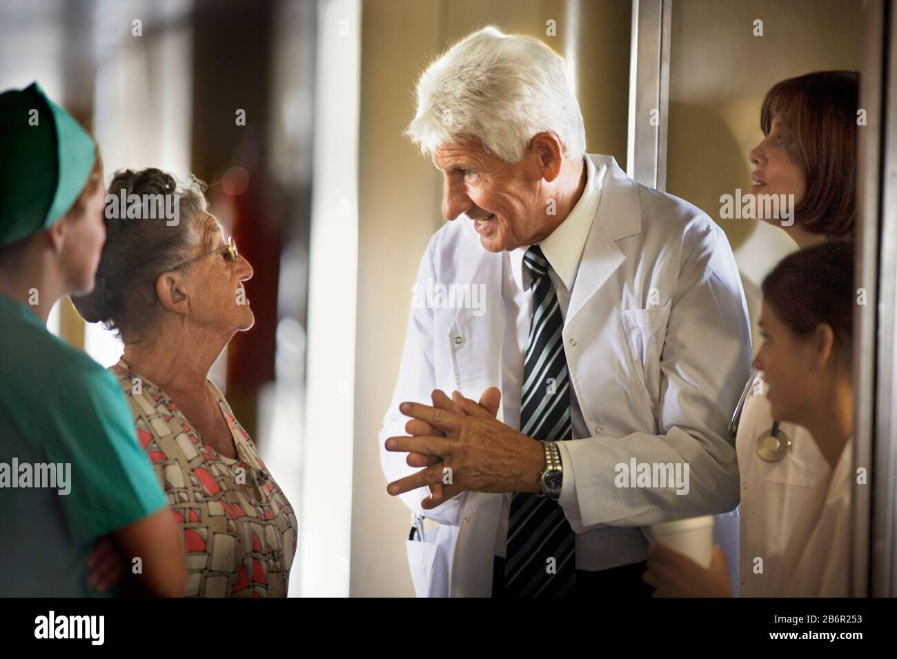 Elderly woman helped up hi-res stock photography and images - Alamy
