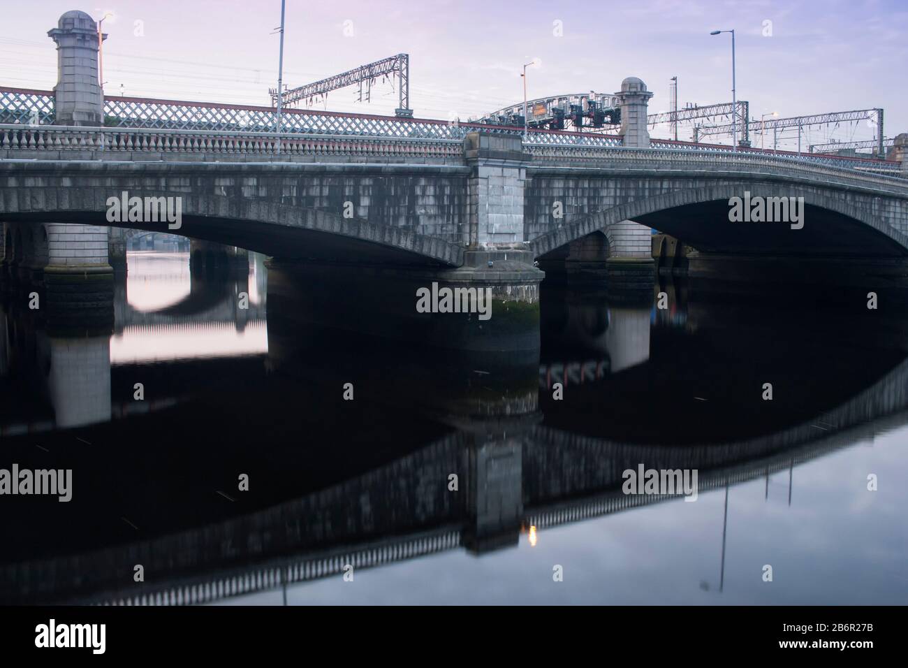 The river Clyde at sunrise on a summer’s day in Glasgow, Scotland. Stock Photo