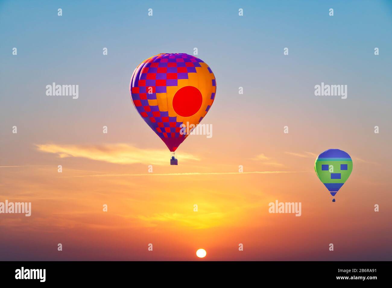 Aerostatic Balloons flying at sunrise Stock Photo