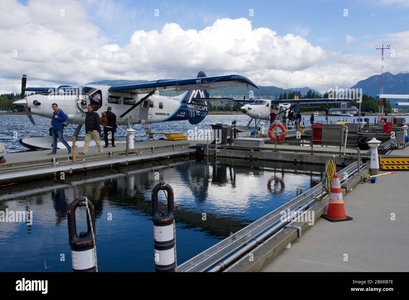 Two Harbour Air DHC-3 de Havilland Turbine Single Otter seaplanes at Coal Harbour, Vancouver, BC, Canada Stock Photo