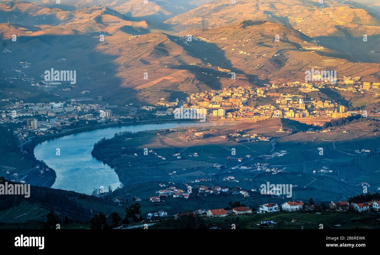 City of Peso da Régua and the Douro River, seen from the Boa Vista viewpoint near Lamego, in Portugal, on a late winter afternoon. Stock Photo