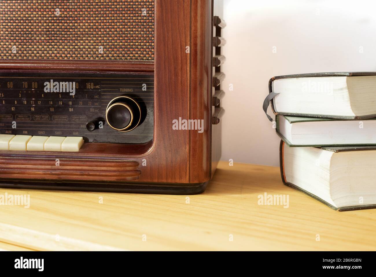 Vintage radio made of wood and old books on a table Stock Photo - Alamy