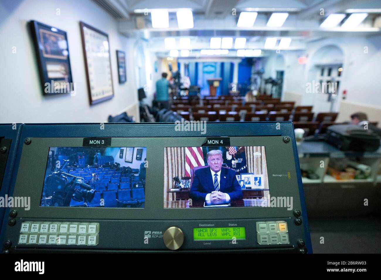 A monitor is seen in the James S. Brady Press Briefing Room of the White House in Washington, DC, U.S., on Wednesday, March 11, 2020 as United States President Donald J. Trump addresses the nation from the Oval Office. Trump announced a month long travel ban to Europe, as well as economic aid to businesses in areas affected by the Coronavirus. Credit: Stefani Reynolds/CNP | usage worldwide Stock Photo