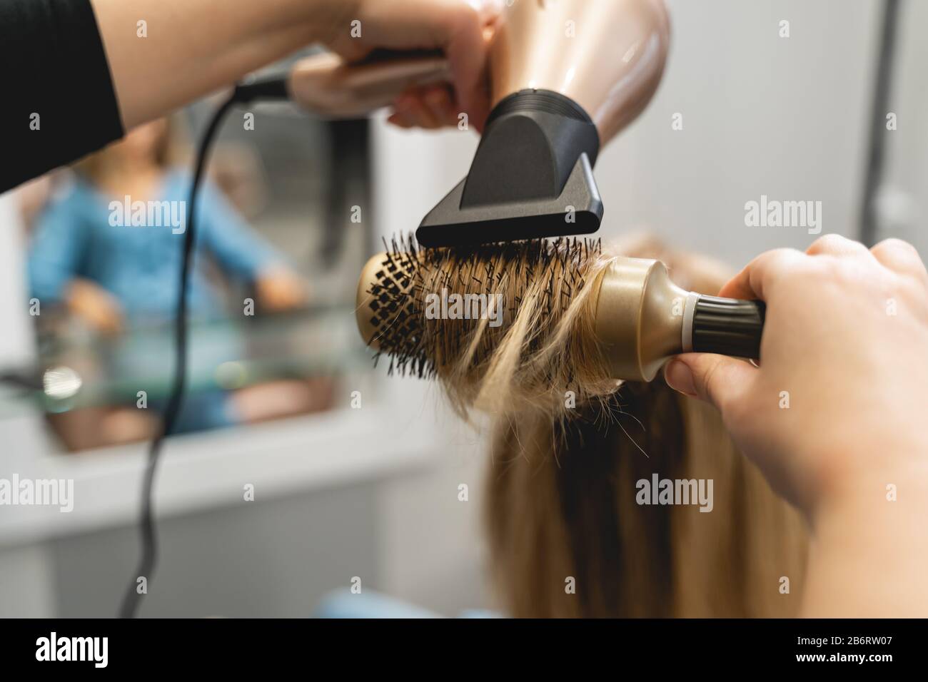 Hair blonde blow dry hi-res stock photography and images - Alamy