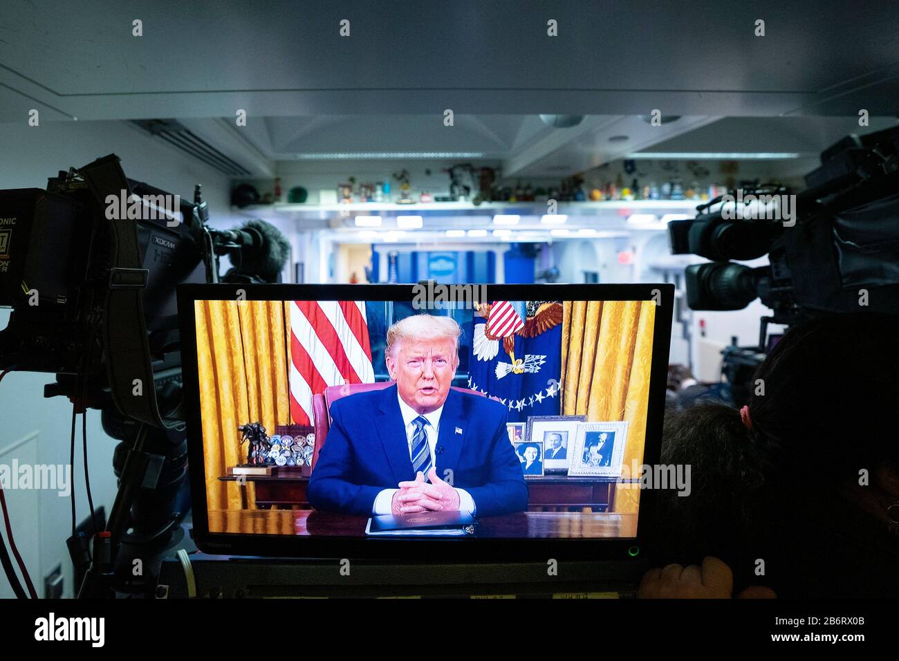 A monitor is seen in the James S. Brady Press Briefing Room of the White House in Washington, DC, U.S., on Wednesday, March 11, 2020 as United States President Donald J. Trump addresses the nation from the Oval Office. Trump announced a month long travel ban to Europe, as well as economic aid to businesses in areas affected by the Coronavirus. Credit: Stefani Reynolds/CNP /MediaPunch Stock Photo