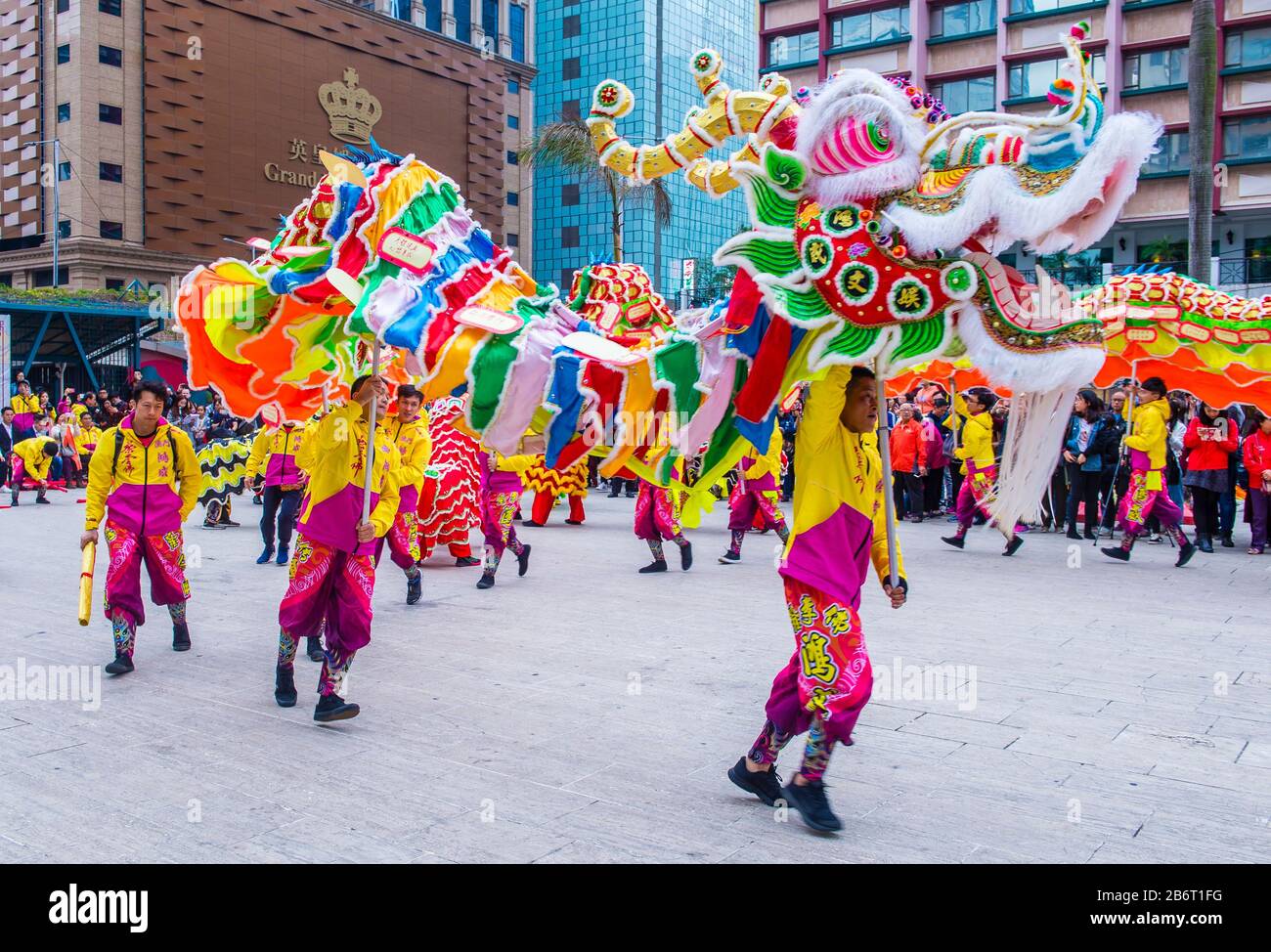 Dancers perform a Dragon dance during the Macau International Dragon and Lion Dance Day event at Praca da Amizade in Macau Stock Photo