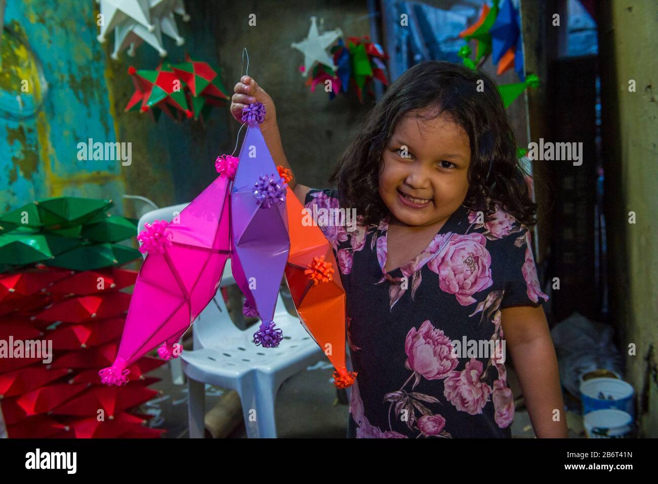 Filipino girl holding a lantern in a Christmas market in Las Pinas city , Manila the Philippines Stock Photo
