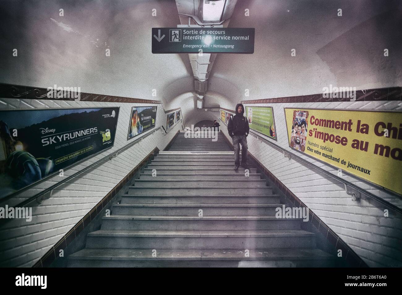 A man walks down the stairs at the Abbesses Metro station in Montmartre ...