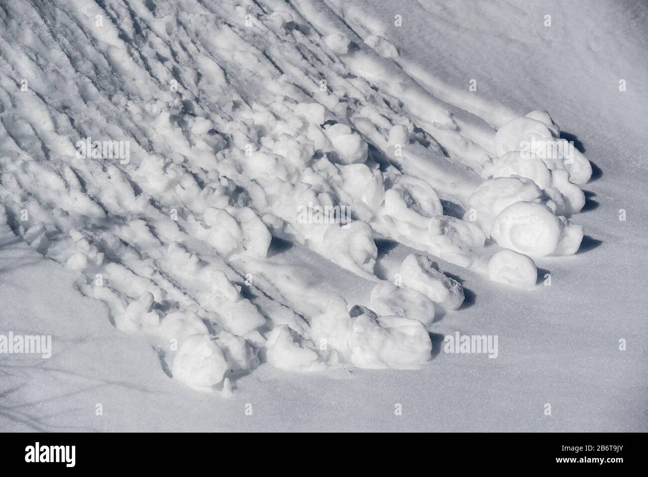 Small wet snow avalanche on a slope in Oregon's Wallowa Mountains. Stock Photo
