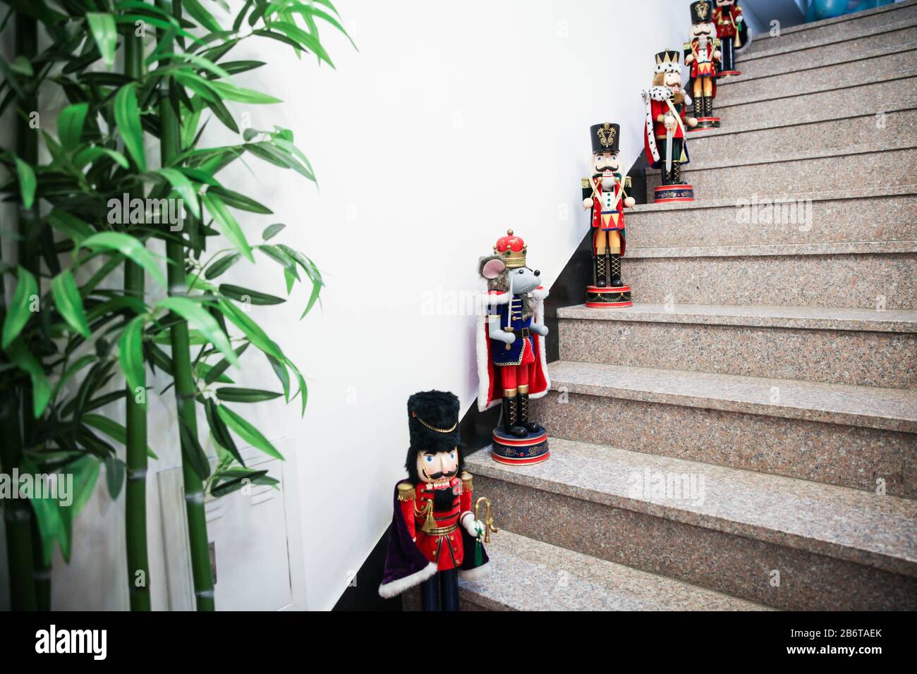 Wooden toys with red British army soldier uniform costume on a stairs Stock Photo