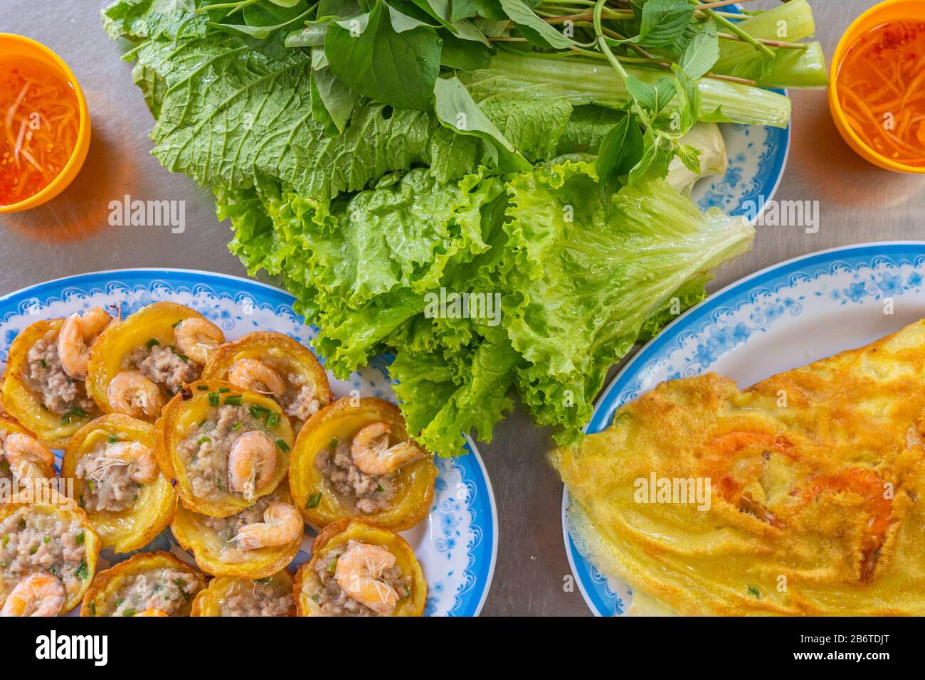 Traditional Vietnamese shrimp pancake and crepe with vegetable and fish