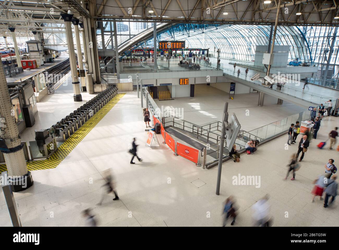 Rail travelers move in a blur along the main Waterloo railway station concourse next to Eurostar terminal. Stock Photo