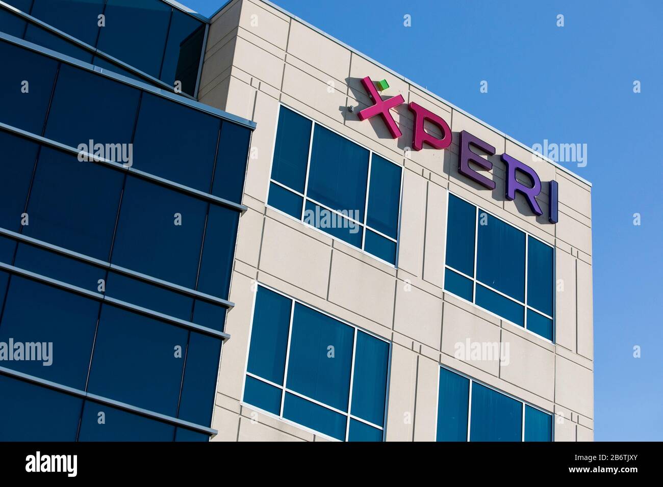 A logo sign outside of a facility occupied by Xperi Corporation in