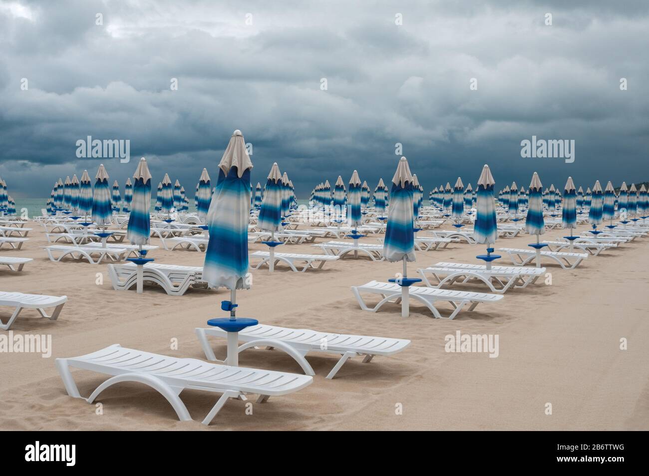 Sunshades has been closed, the spell of fine weather has broken. Beach season is finished. Stock Photo