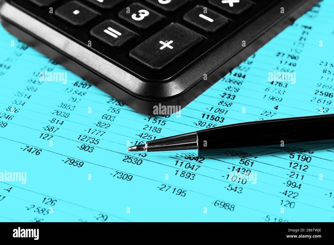 Financial concept. Calculator, pen and glasses on financial documents. Financial accounting. Balance sheets. Closeup of financial statements and annua Stock Photo