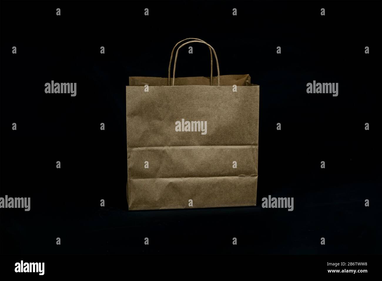 Brown paper bag on black background. Disposal paper bag Stock Photo Alamy