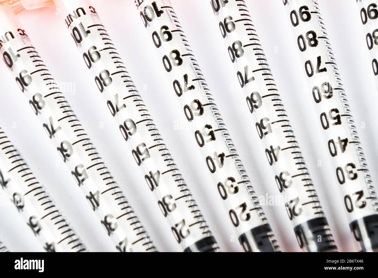 Pile of insulin syringe for diabetes isolated on white background. Close-up empty syringe isolated in a raw. Plastic insulin syringe. Injection medici Stock Photo