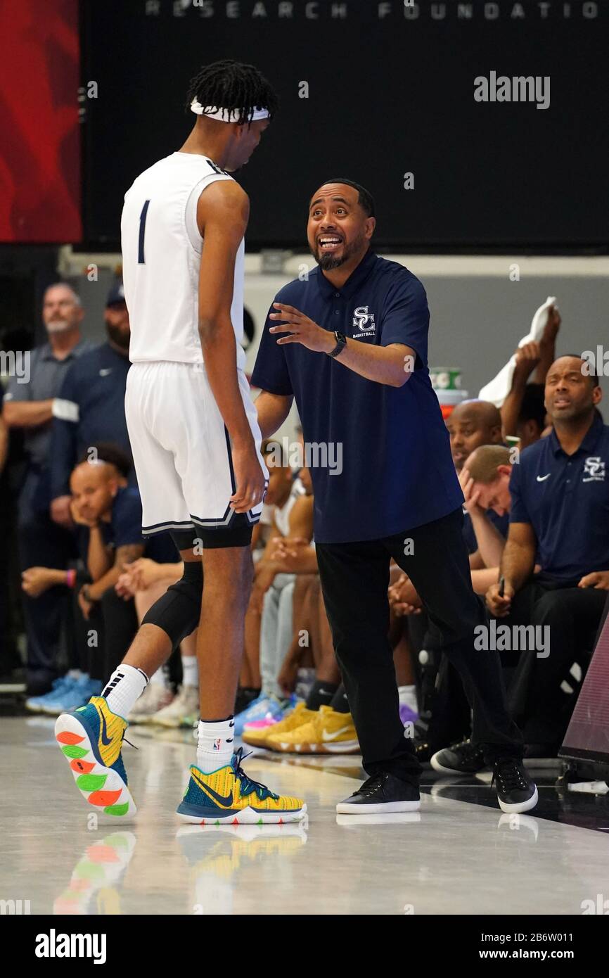 Sierra Canyon Trailblazers coach Andre Chevalier talks with forward Ziaire  Williams (1) against the Etiwanda Eagles during a CIF State Open Division  Southern Regional final high school basketball game, Tuesday, March 10,