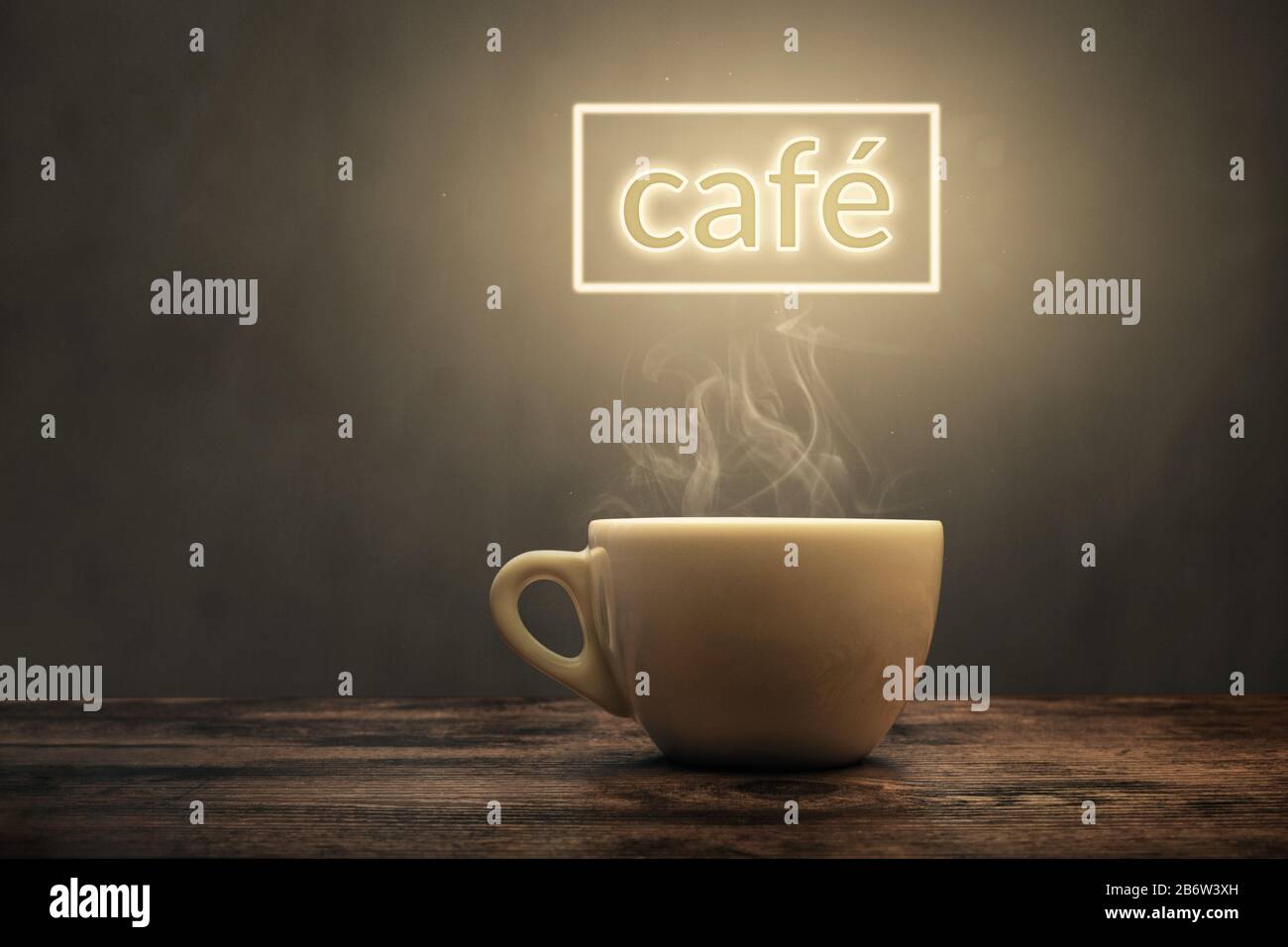 Steaming cup under a glowing café sign Stock Photo
