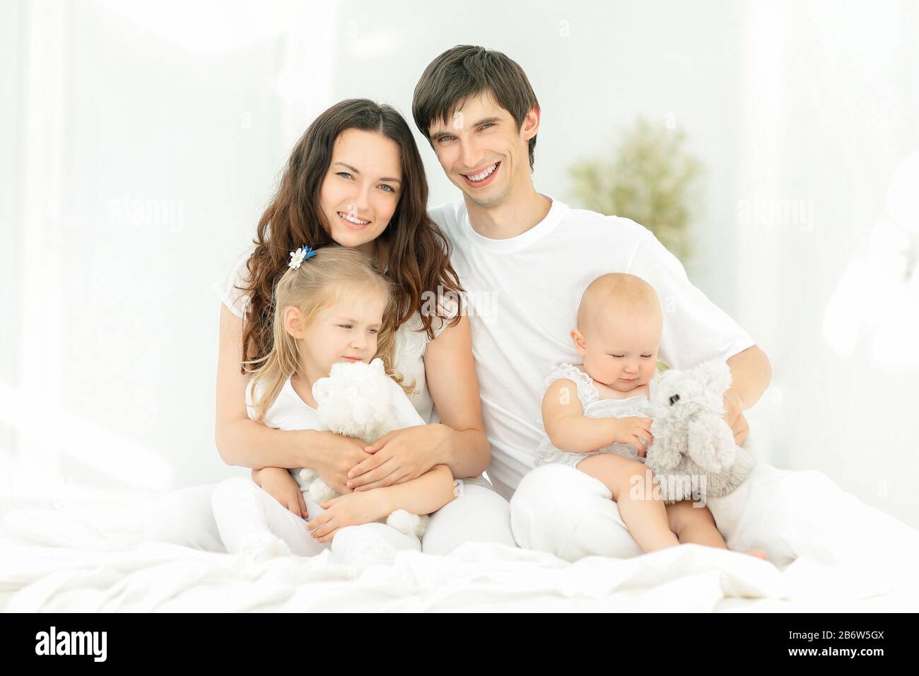 background image of a young happy family Stock Photo - Alamy