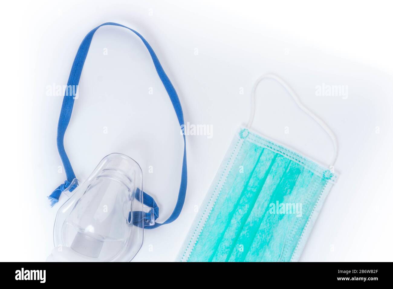 Medical ultrasonic inhaler or nebulizer oxygen mask and hygienic face masks  on white background, copy space Stock Photo - Alamy