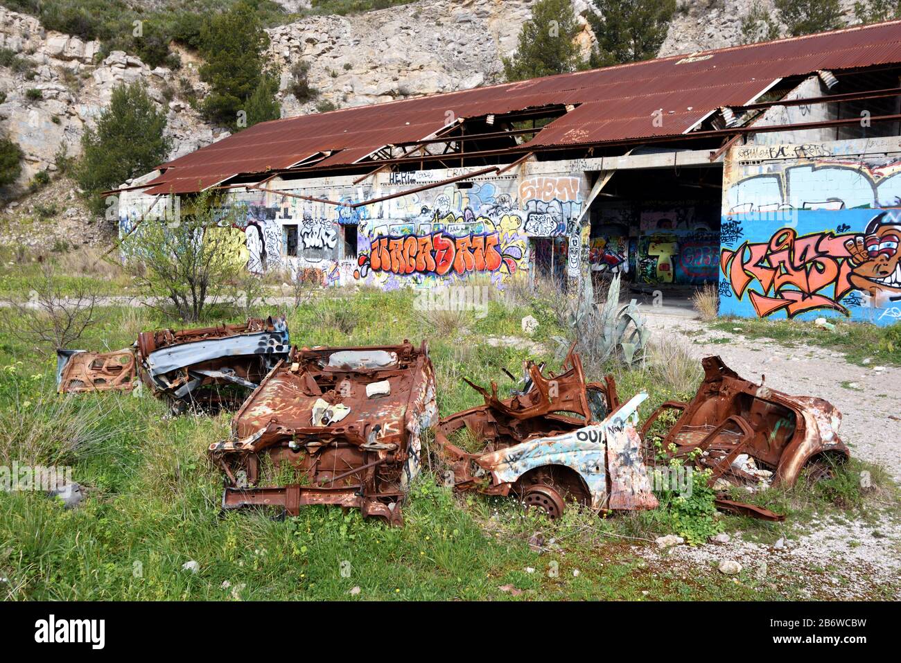 Abandoned Factory, Ruined Industrial Building & Rusty Wrecked Cars, an Urbex Site, in Marseille Provence France Stock Photo