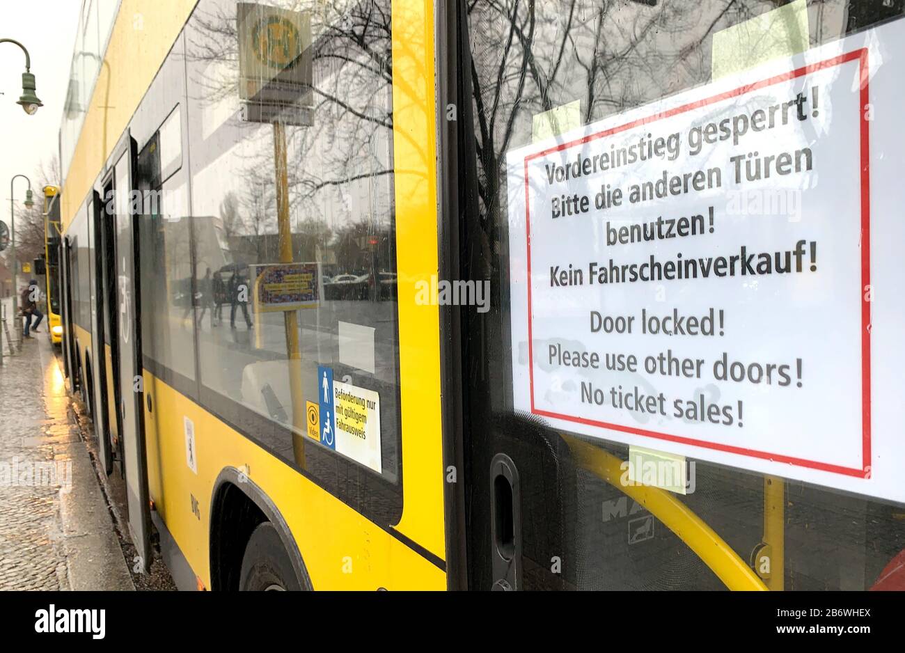 Berlin, Germany. 12th Mar, 2020. A sign on the M29 bus of the BVG indicates to passengers to use the rear doors for boarding. In addition, tickets are no longer sold on the bus to protect the driver from the coronavirus. Credit: Kay Nietfeld/dpa/Alamy Live News Stock Photo